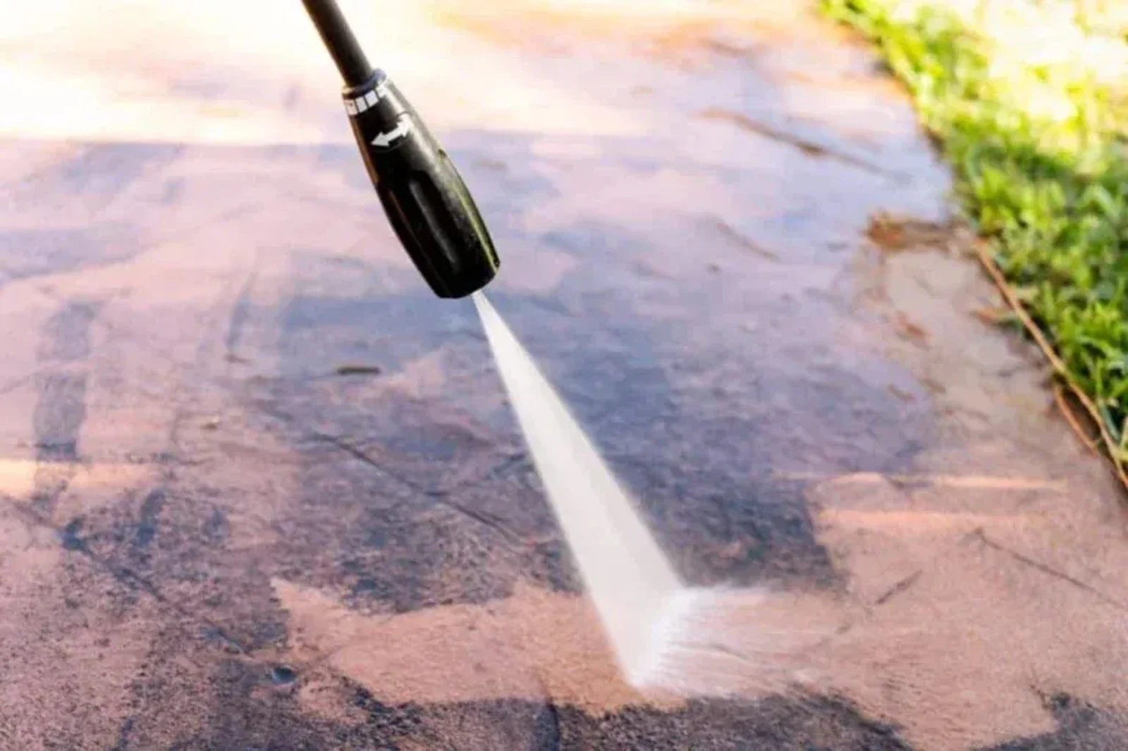 Illustrative pressure washing of an outdoor paved surface